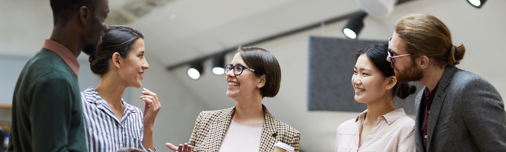 group of employees in office laughing